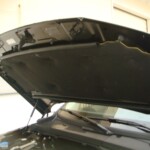 Before and after photographs of a damaged, black, Range Rover that was repaired by Elite Paint & Body Shop in West Palm Beach, FL.